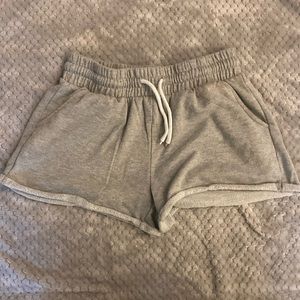 Shorts that are gray and say pink on the back